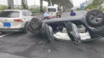 Tesla Model 3 resting on its roof after the rollover accident in Shanghai China.