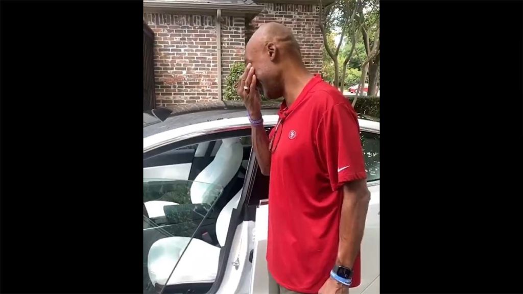 Past NBA player Vince Carter receives his Father's Day gift, a white Tesla Model 3 from his son Solomon Thomas who is a NFL player.