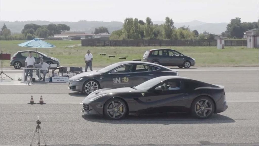 Tesla Model S P100D and Ferrari F12 getting ready for the 1/4-mile drag race.