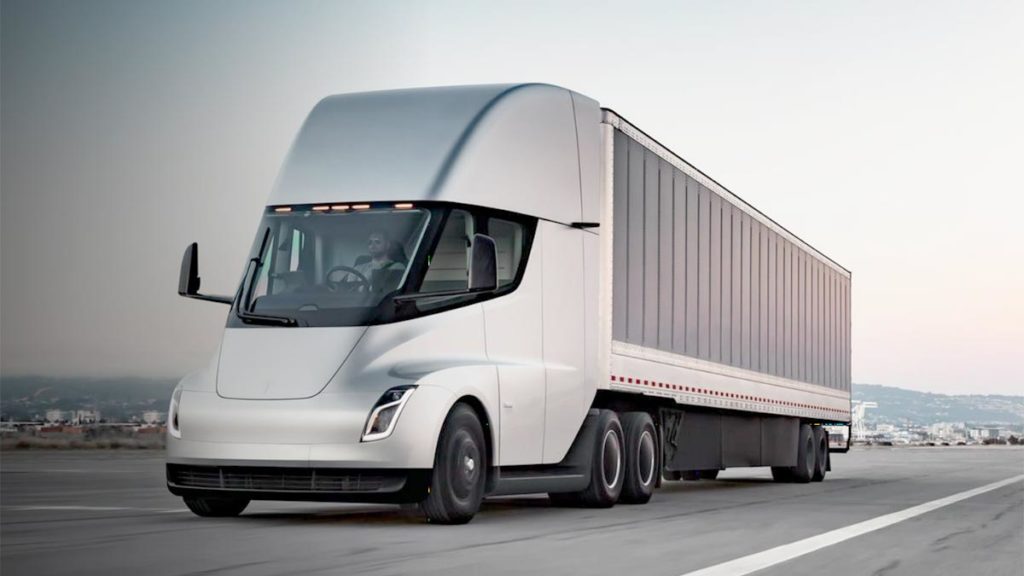 Tesla Semi Truck prototype in silver color, accelerating on the highway.