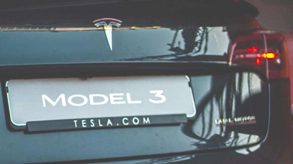 Tesla Model 3 rear license plate with Tesla.com written underneath.