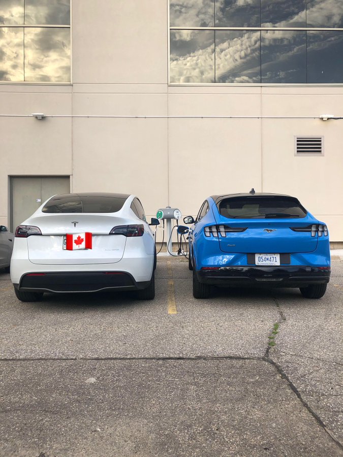 Tesla Model Y and Ford Mache-E Prototype charging side-by-side in Waterloo, Canada.