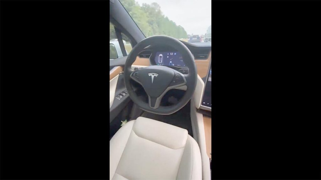 Tesla Model S running on Autopilot while the owner is filming from the passenger seat.