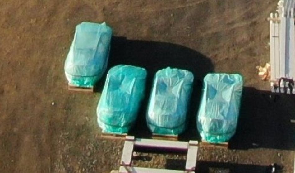 Tesla Model Y body shells at the Gigafactory Berlin (closeup aerial photo).