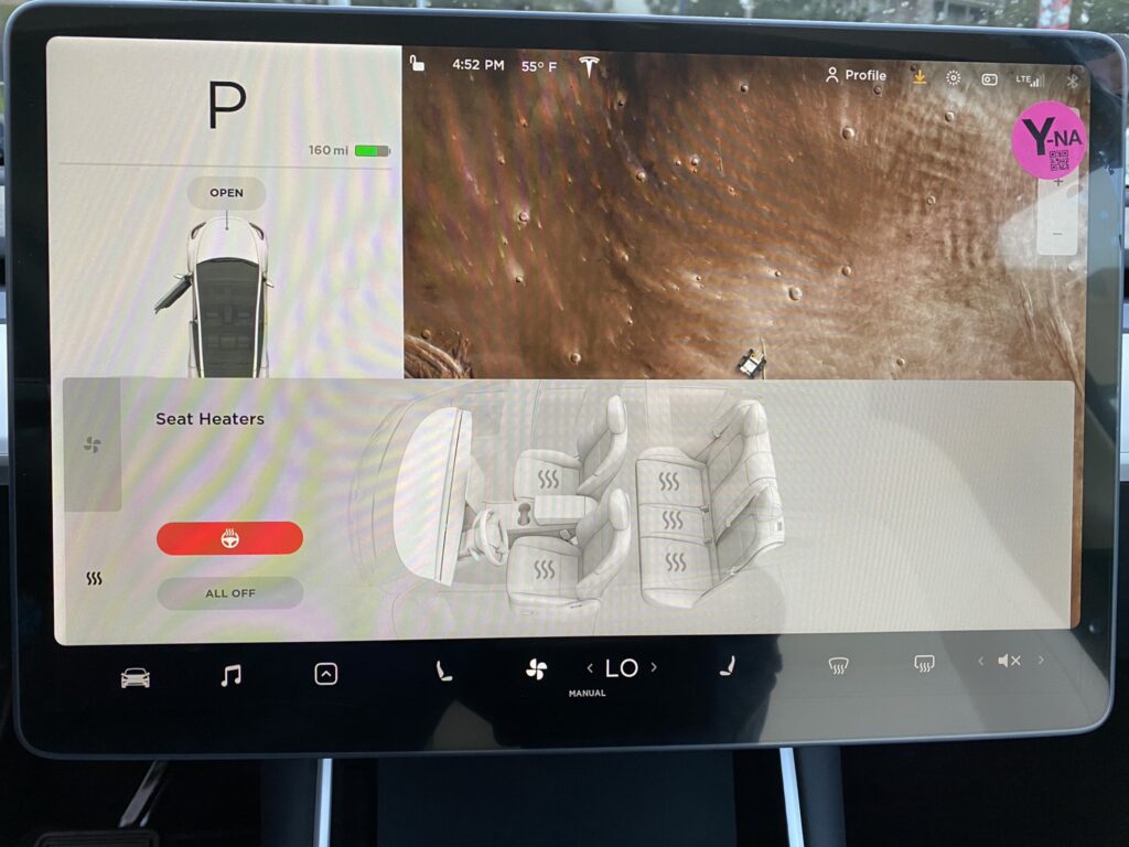 User interface on the center display for the Tesla Model Y heated steering wheel feature.