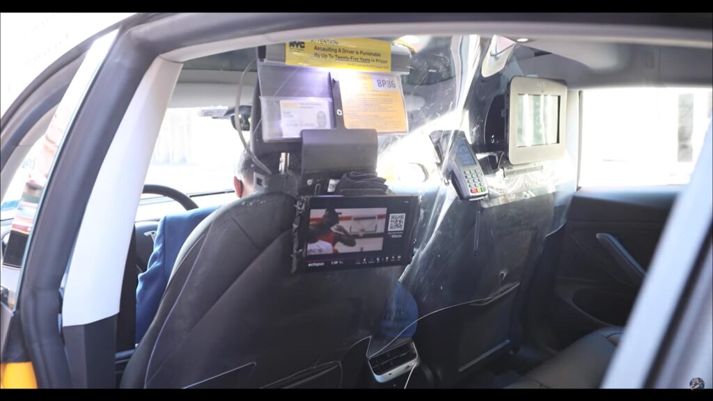 Rear LED display screens and payment terminal for the Tesla Model 3 NYC yellow cab.