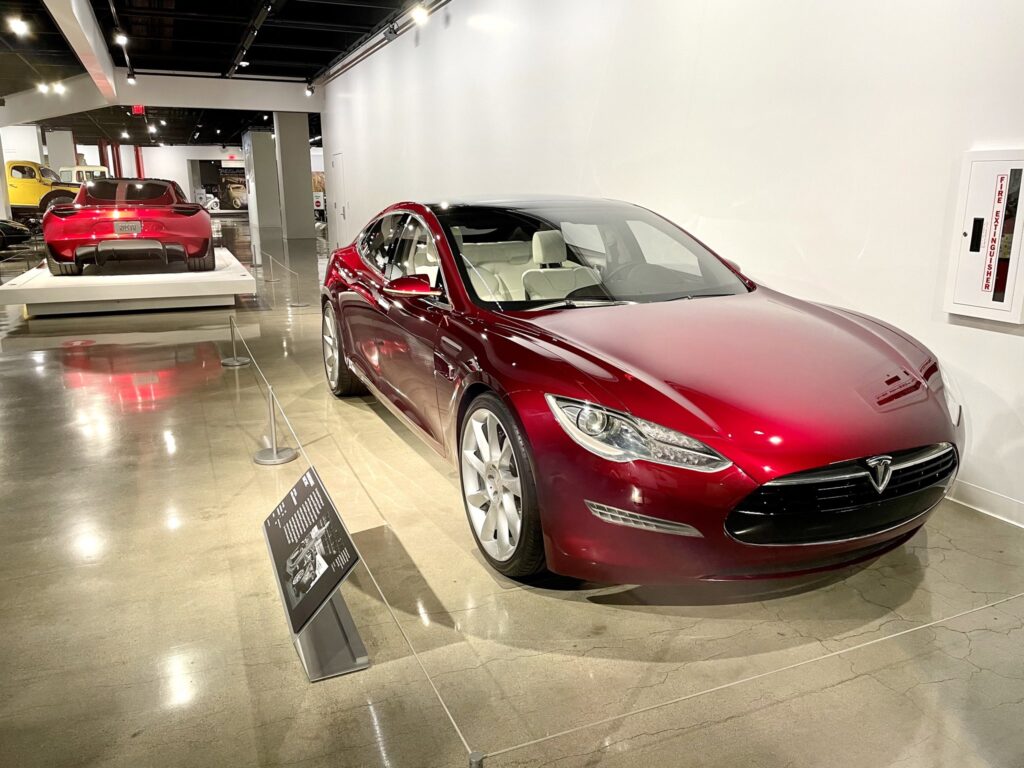 An early Tesla Model S prototype (front) and the next-gen Tesla Roadster (background).