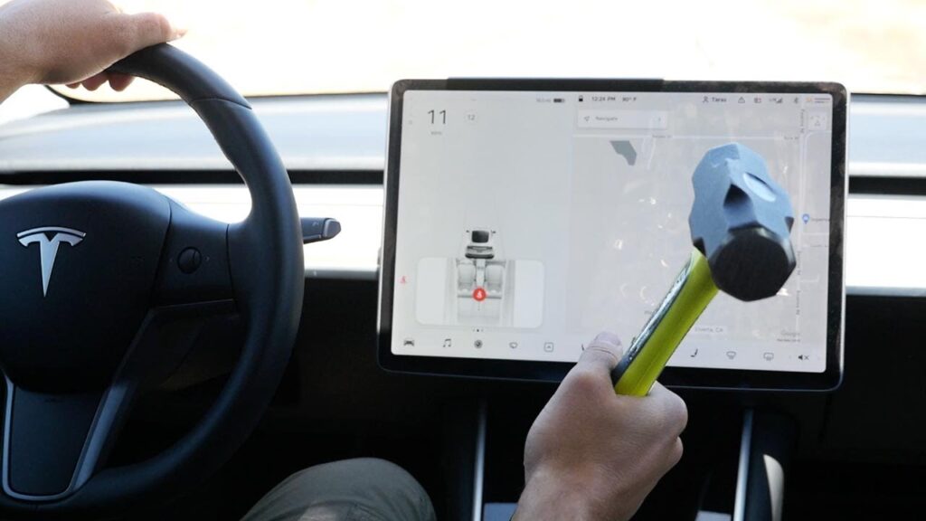 Breaking the Model 3 center toucscreen with a hammer while driving.