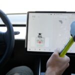 Breaking the Model 3 center toucscreen with a hammer while driving.