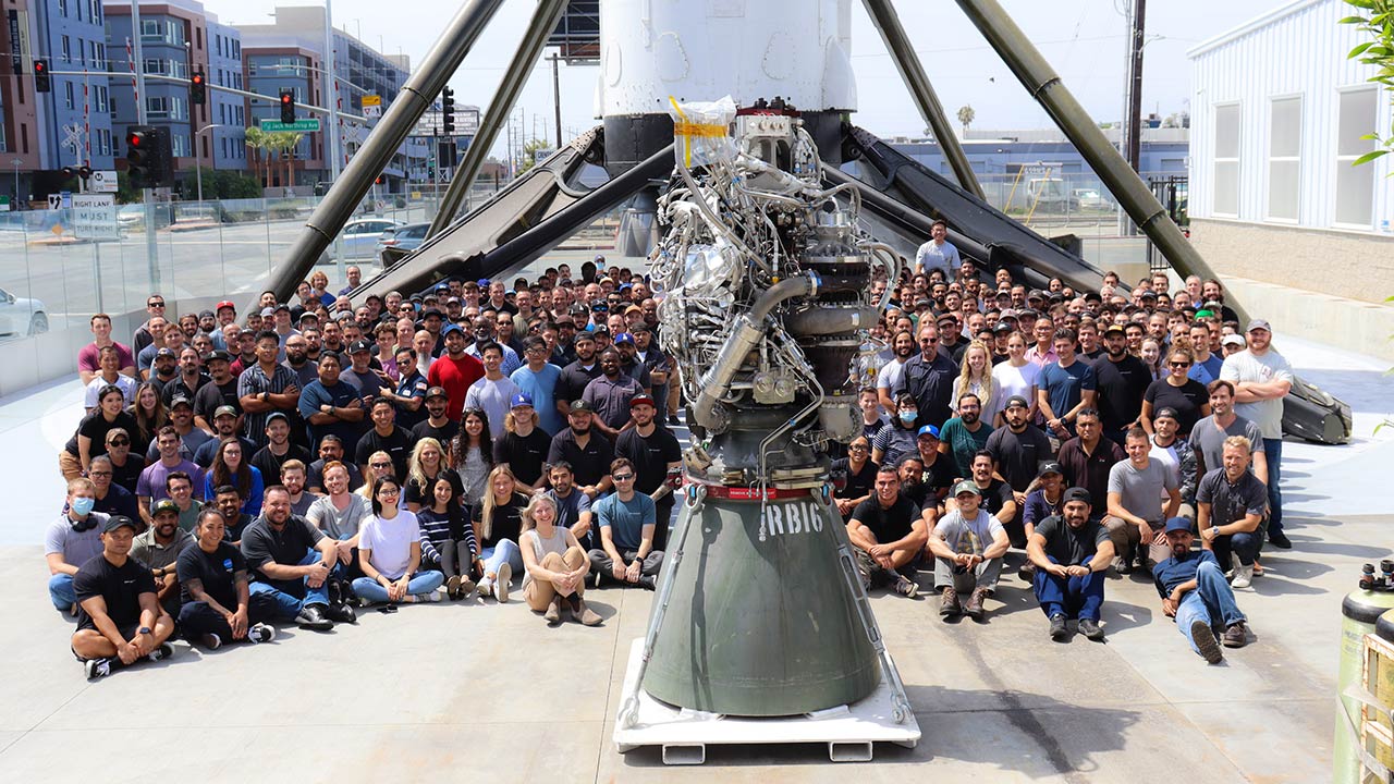 SpaceX rocket engineers celebrating the 100th build of the Raptor engine.