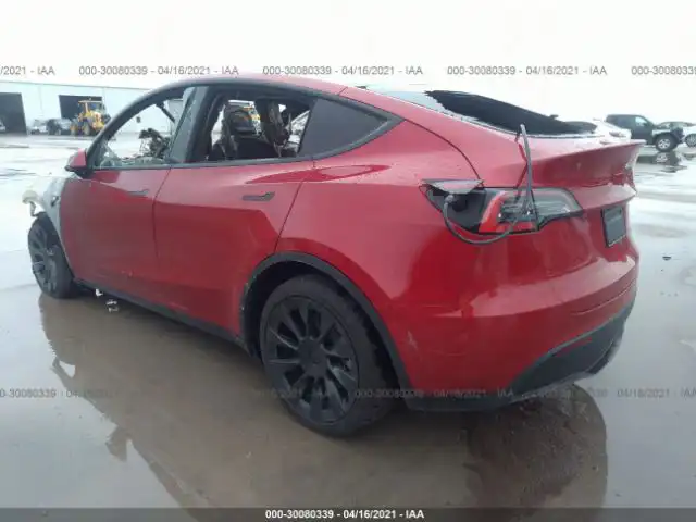 Tesla Model Y from Dallas, Texas fire (rear side view of the damaged car from the incident).
