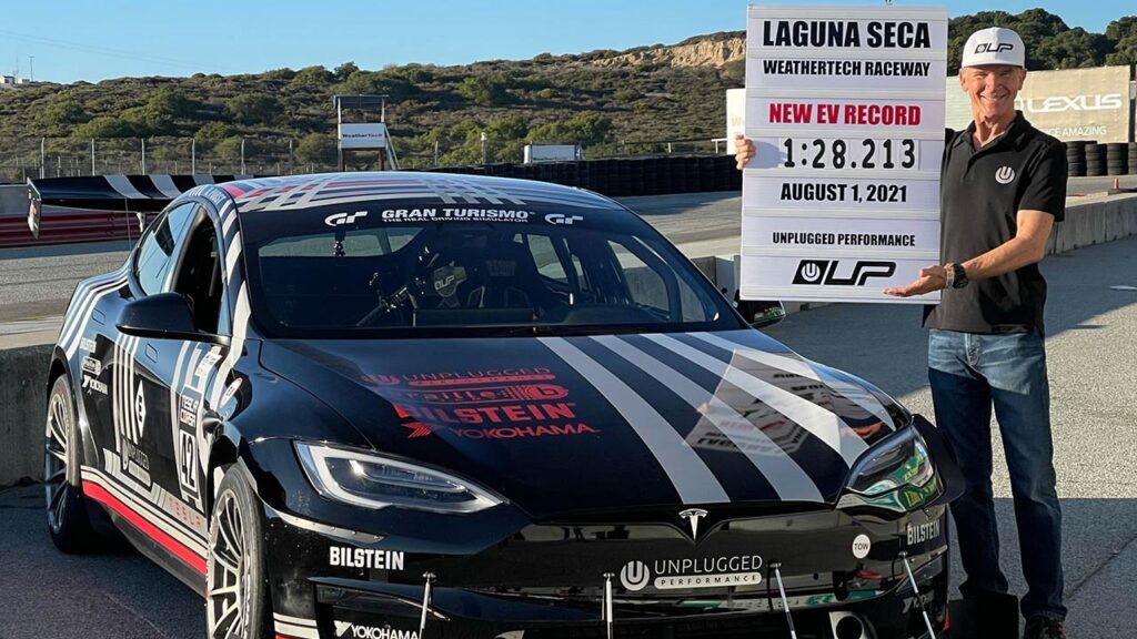 Randy Pobst with his Unplugged Performance Tesla Model S Plaid after scoring the best EV lap record at the Laguna Seca Raceway (video in article).