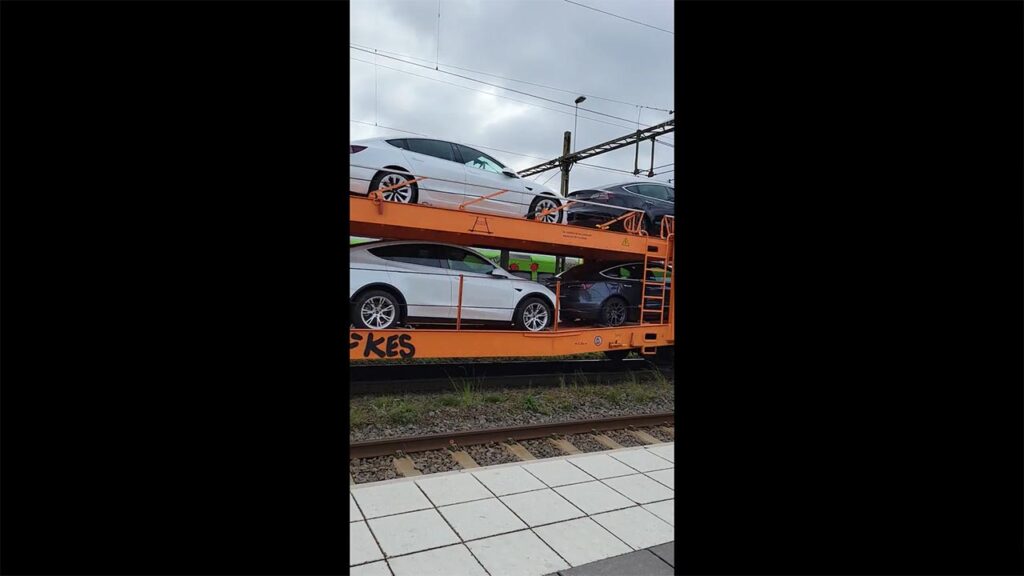 Tesla cars getting transported on a train in Europe.
