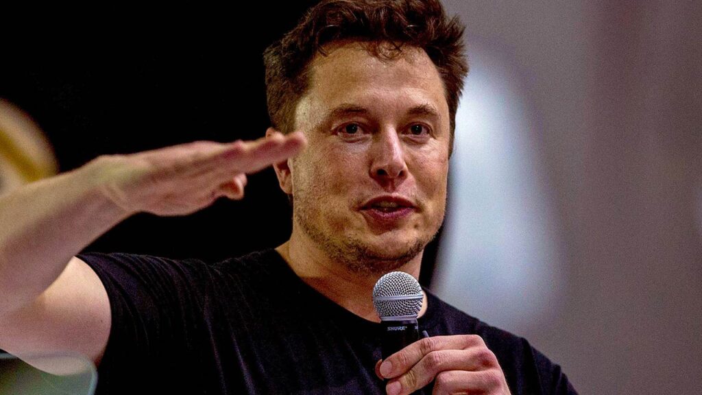 Elon Musk with mic in hand.