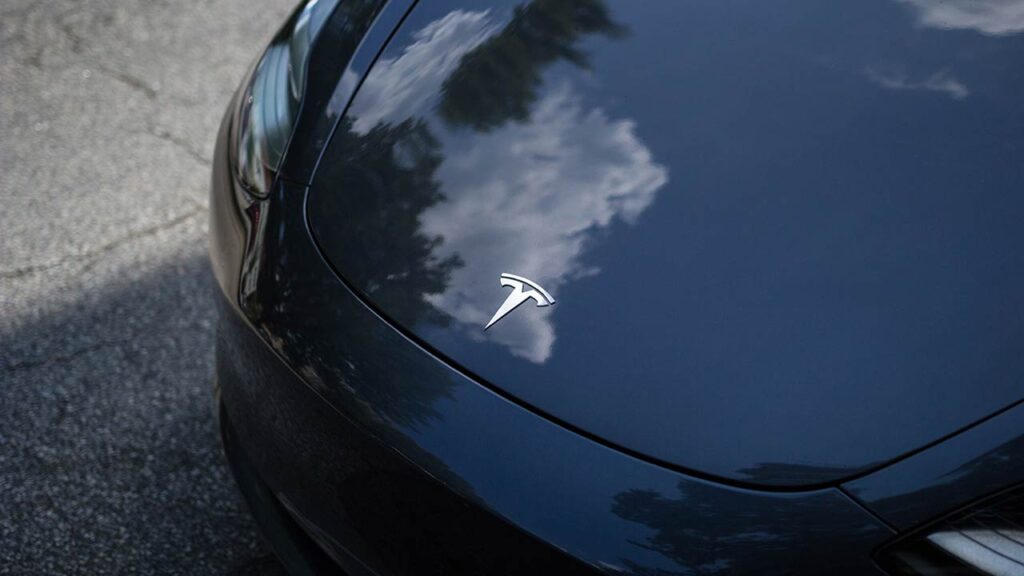 Tesla logo on the frunk (front trunk) of a Tesla Model 3.