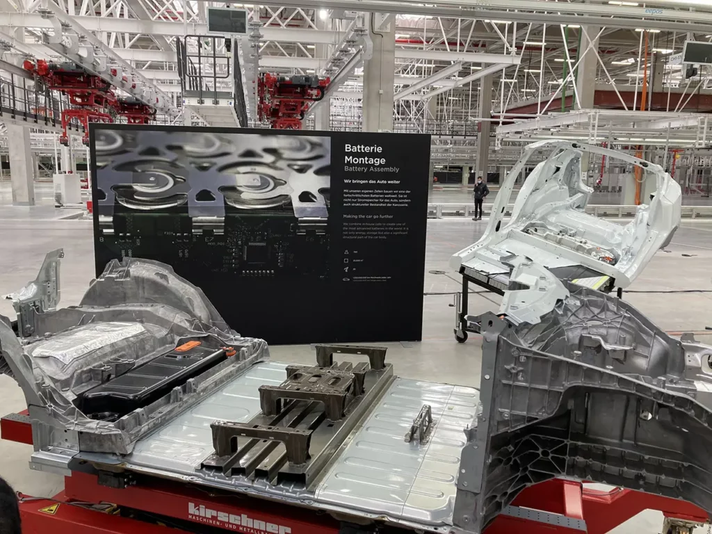 Tesla Model Y structural battery pack with front and rear single-piece mega castings displayed at Gigafactory Berlin.