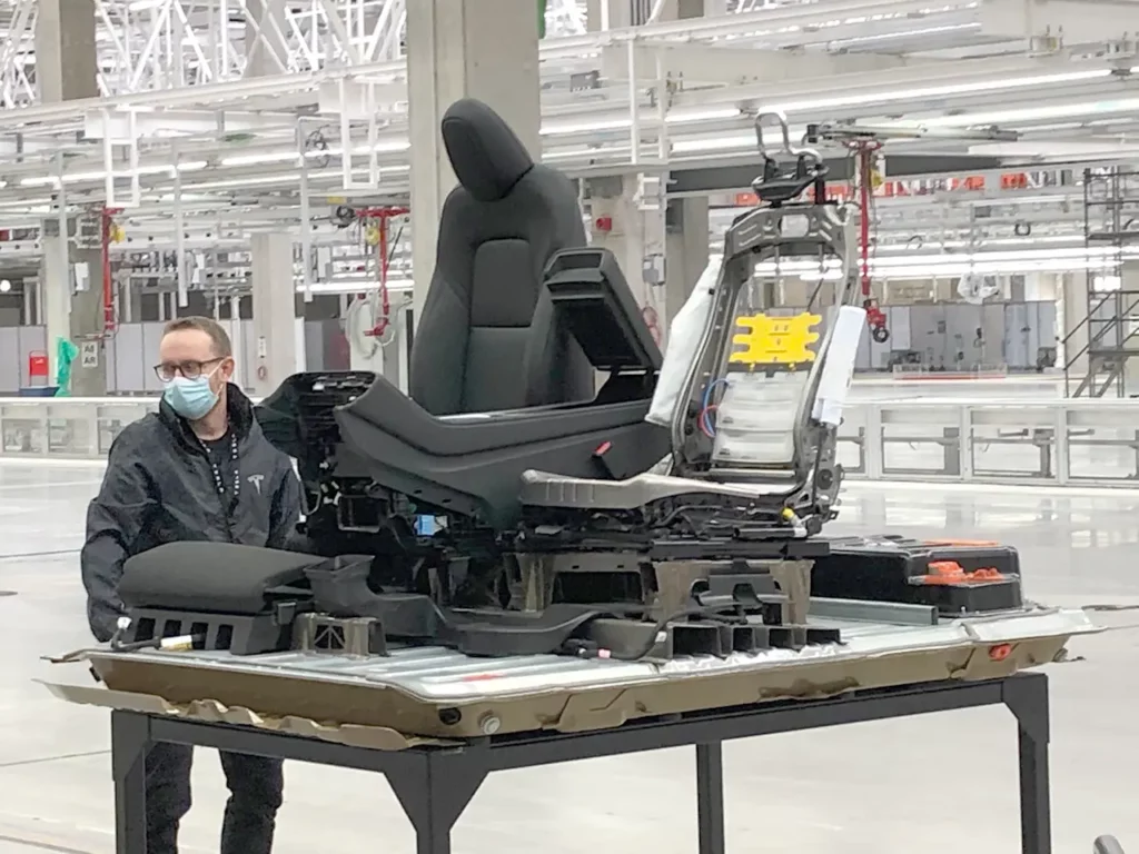 Tesla Model Y structural battery pack with the front seats mounted on the pack as displayed at Giga Berlin Giga-Fest.