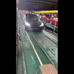 Tesla Model 3 and Model Y being unloaded from a train in Switzerland.