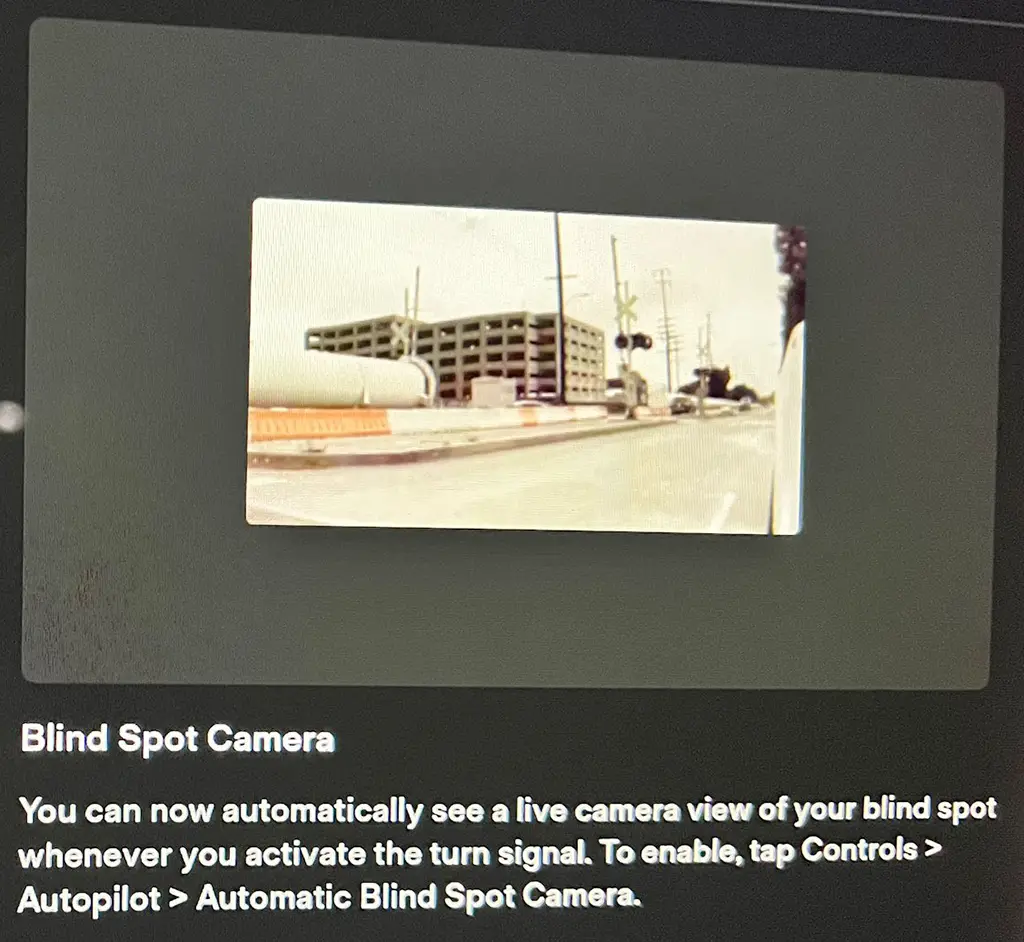 Tesla adds blind spot camera views in the 2021.44.25 Holiday Update.