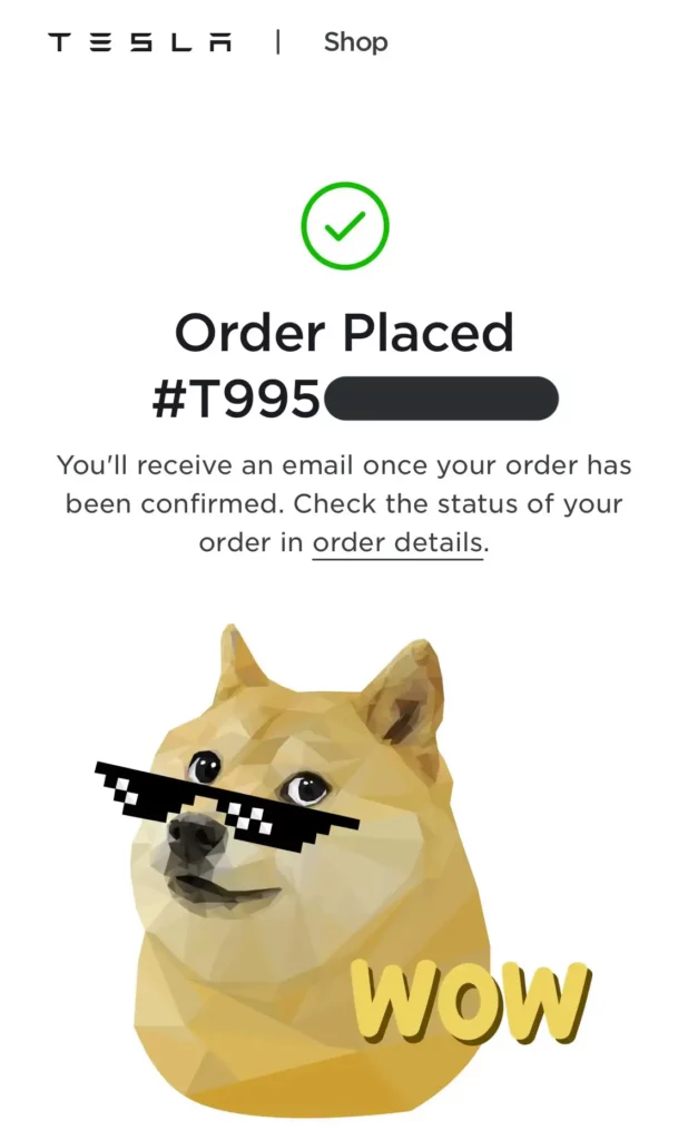 Tesla online shop order confirmation screen with Shiba Inu when an item is bought using Dogecoin.