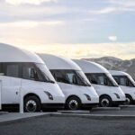 Four Tesla Semi-trucks parked at the Giga Nevada Megacharger station.