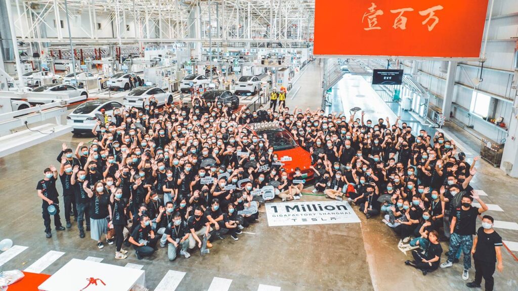 Tesla Giga Shanghai employees celebrating the production of the 1 millionth Tesla EV produced at the plant.