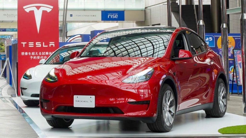 Giga Shanghai-made Tesla Model Y (red) and Tesla Model 3 (white) on display at a Tesla store in China.