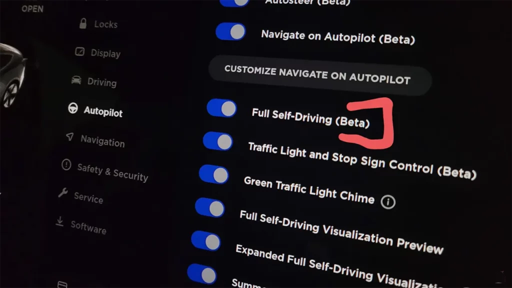 Tesla vehicle center touchscreen showing Full Self-Driving Beta option turned ON.