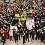 Giga Berlin employees celebrating the production of 4,000 Tesla Model Y SUVs per week in February 2023.