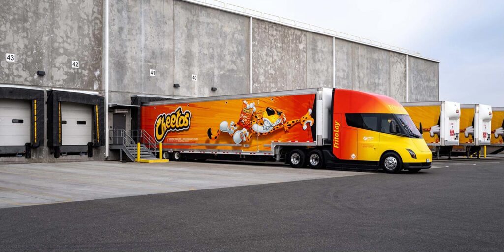 FritoLay's Tesla Semi truck colored in Cheetos/Frito-Lay branding that PepsiCo is using for logistics in the United States.