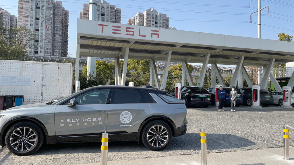 Cadillac parks a LYRIQ electric SUV at a Tesla Supercharger in China offering free test drives to Tesla owners.