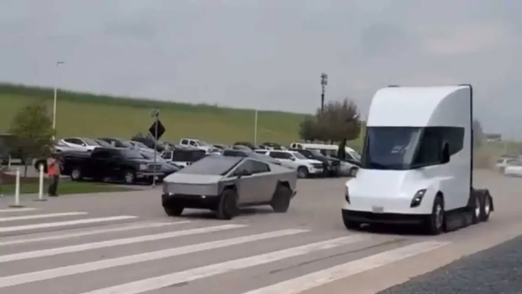 Tesla Semi and Cybertruck side-by-side getting ready for a drag race outside Giga Texas.