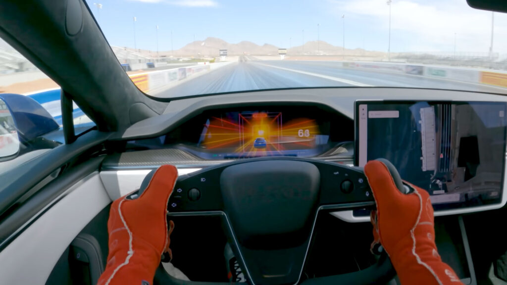 Tesla Model S Plaid running in Drag Strip Mode accelerating at a a dragstrip.