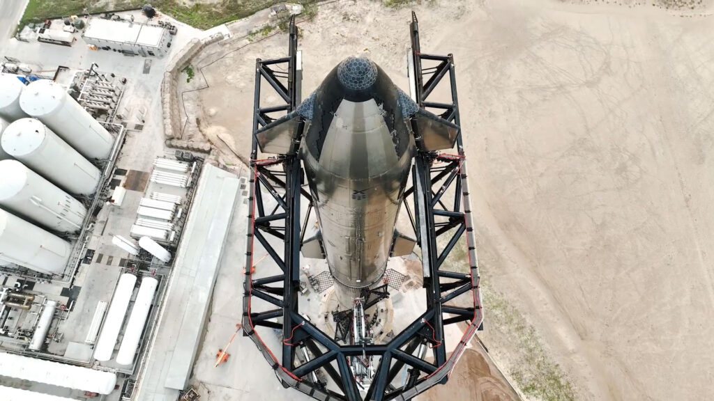 Aerial view of Starship 24 prototype as it is stacked on Booster 7 rocket before the 1st orbital flight test.
