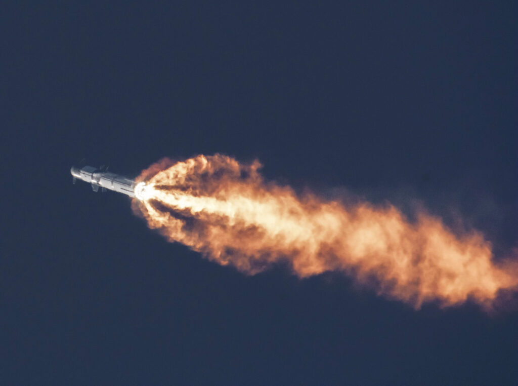 Starship throwing engine flames from the Super Heavy Raptor engines mid air during the flight test on Thursday 20th April 2023.