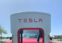 A Ford F-150 Lightning electric pickup truck parked at Tesla Supercharger (file photo).