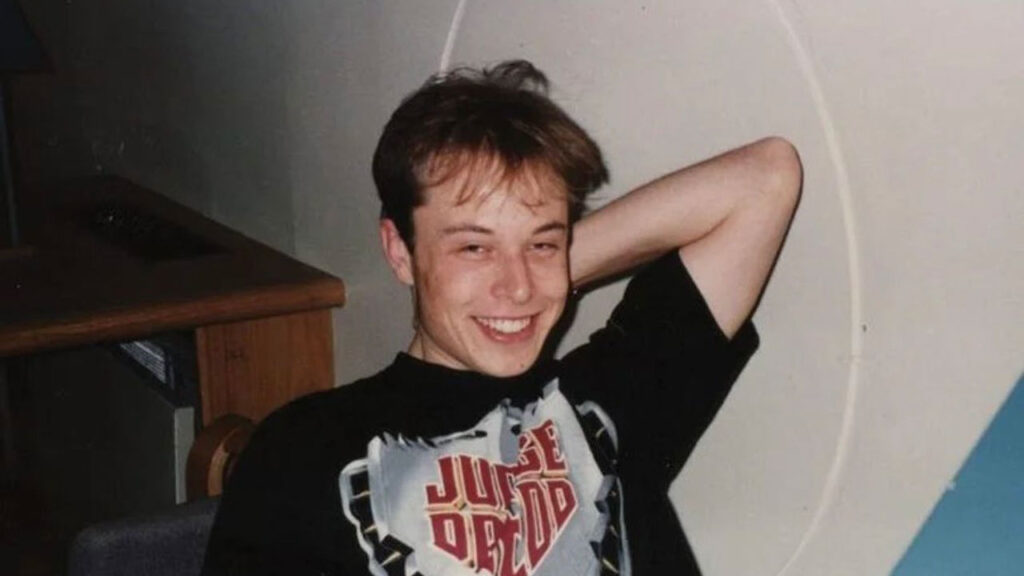 Young and happy Elon Musk in his study room.