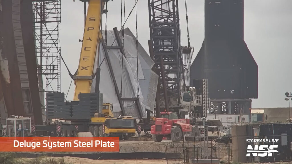 The water deluge system steel plate getting transported to be installed under the Orbital Launch Mount (OLM) at Starbase, Texas.