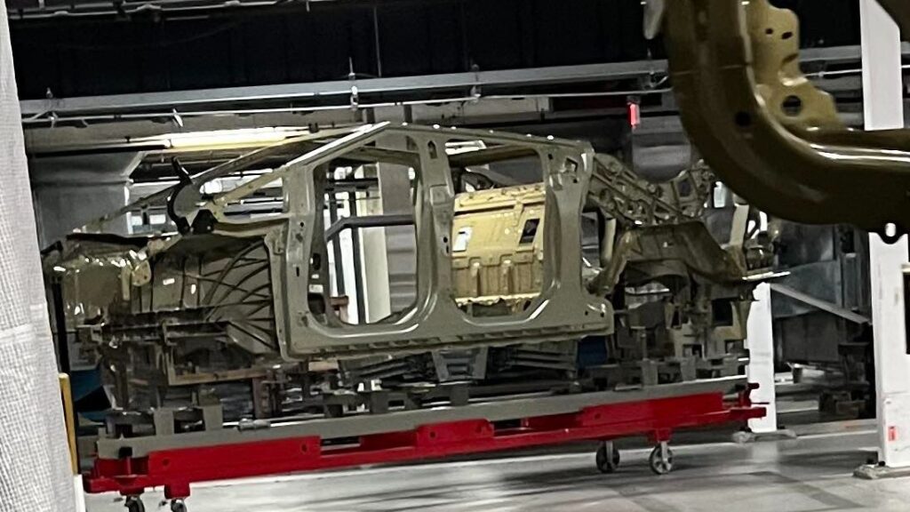 Leaked picture of the Tesla Cybertruck internal structure from the production line at Giga Texas — showing door panels and front and rear Giga Castings.