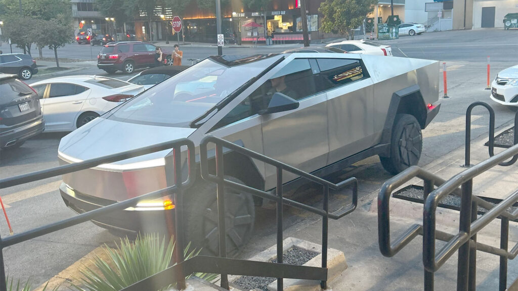 Tesla Cybertruck parked outside Rising Cane's restaurant in Austin, Texas.
