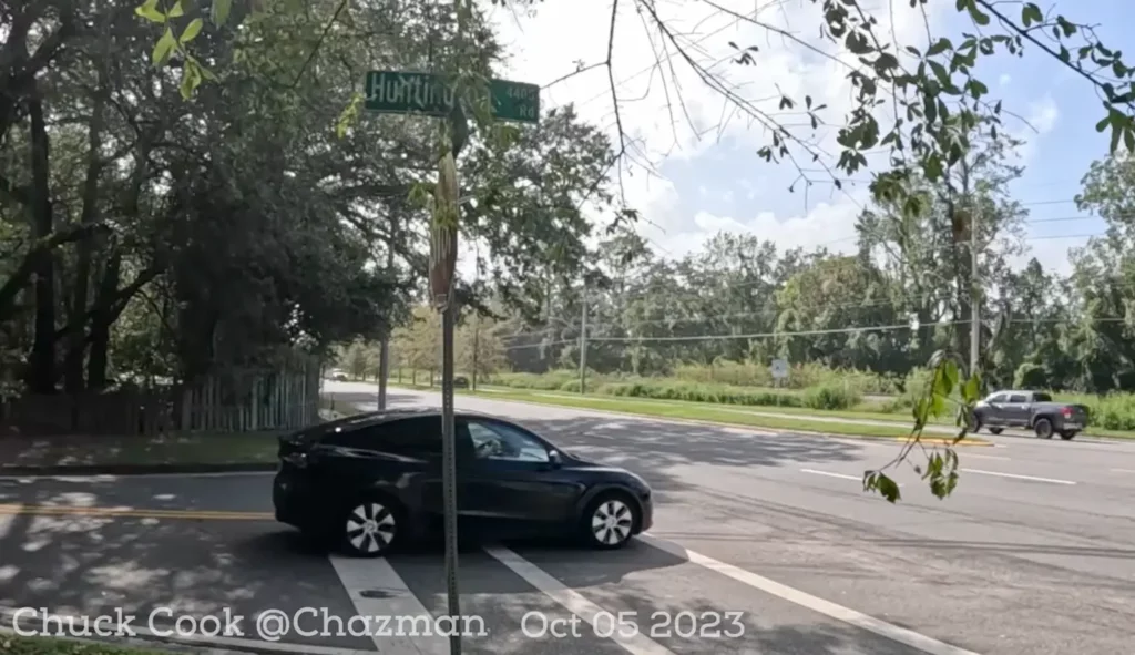 FSD V12 Tesla Model Y test vehicle creeping forward at Chuck Cook's unprotected left turn in Jacksonville, FL.