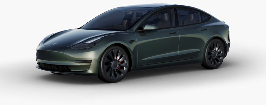 A Tesla Model 3 wrapped in Forest Green color.