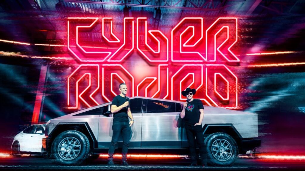 Tesla Chief Designer Franz von Holzhausen (left) and Tesla CEO Elon Musk (right) standing beside the Cybertruck at Giga Texas Cyber Rodeo (7th April 2022).