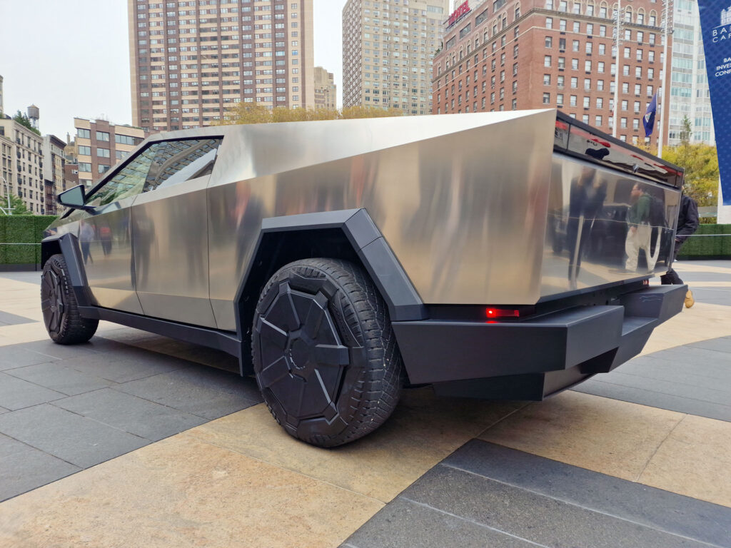 Side profile of the Tesla Cybertruck captured from the rear while on public display in New York at the 30th Annual Baron Investment Conference.