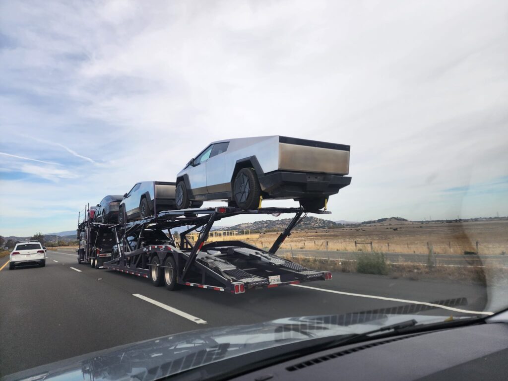 Tesla Cybertruck pickup trucks loaded on a vehicle transport trailer spotted near San Francisco, California around 20th November 2023.