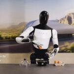 Tesla Optimus Gen 2.0 humanoid robot handling delicate objects like eggs with ease.