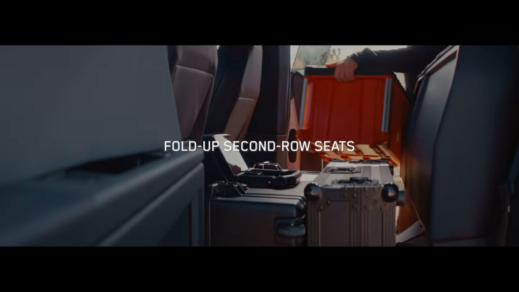 Folding up the second-row seats of the Cybertruck creates ample space for storing boxes, bags, and suitcases.