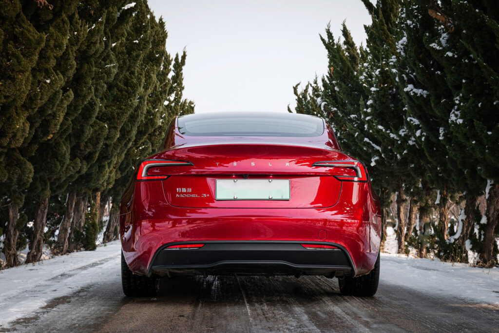 The rear fascia of the Made-in-China Tesla Model 3 Highland in Ultra Red color.
