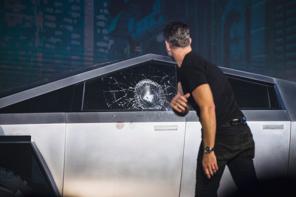 Tesla Chief Designer Franz von Holzhausen throws a steel ball at the Cybertruck window that shatters the glass at the electric pickup truck's unveiling event at the company's Design Studio in Hawhtorne, California on 21st November 2019.