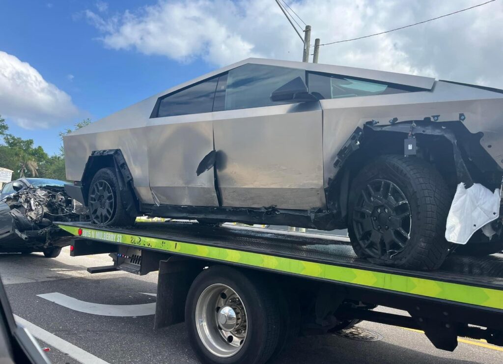 T-boned Tesla Cybertruck and a Nissan car towed from the crash site in Tampa, Florida.